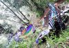 Wreckage of mini-bus lying in gorge in Thanamandi area on Sunday. —Excelsior/Gafoor Bhat