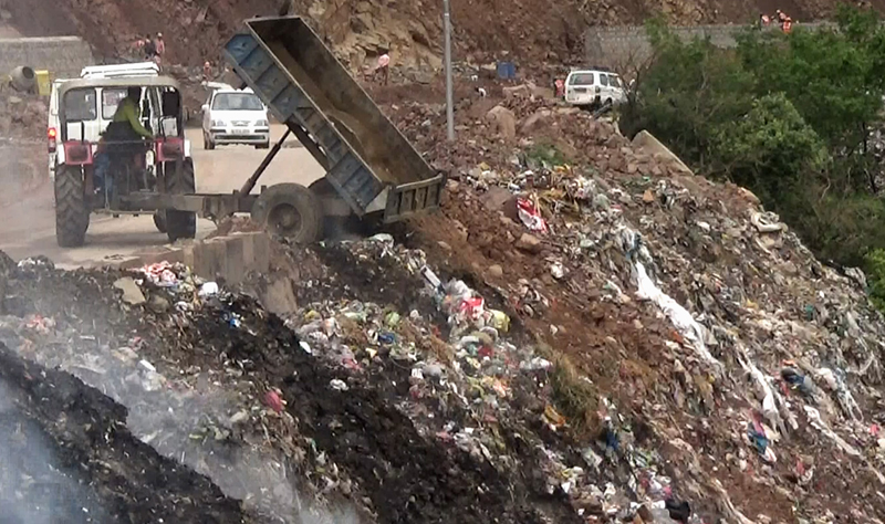 Garbage being dumped near National Highway at Jakhani. Garbage being dumped near National Highway at Jakhani.