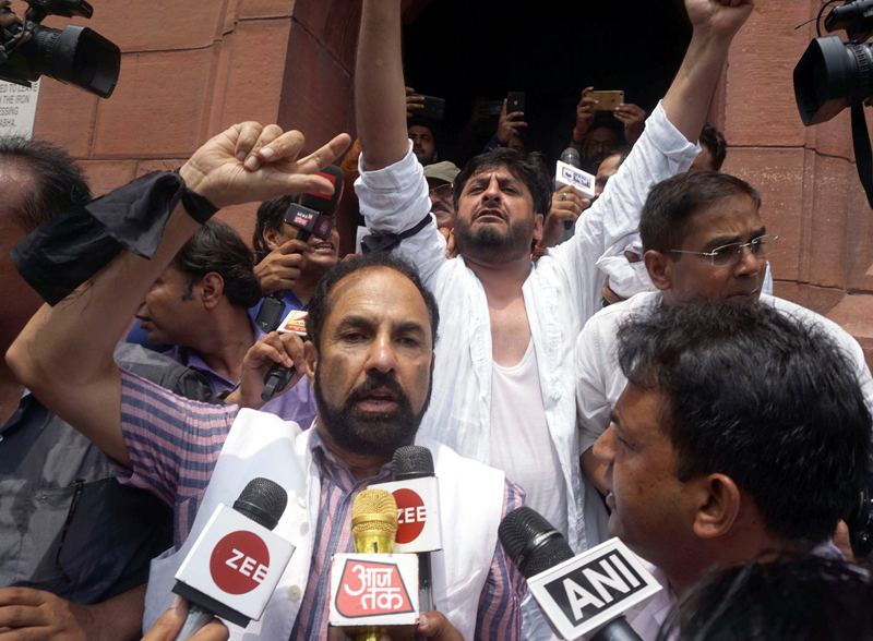 PDP MPs Nazir Ahmad Laway and Fayaz Ahmad Mir raising slogans while coming out of the Parliament House in New Delhi on Monday. (UNI) PDP MPs Nazir Ahmad Laway and Fayaz Ahmad Mir raising slogans while coming out of the Parliament House in New Delhi on Monday. (UNI)