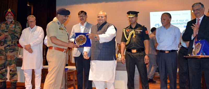 Governor Satya Pal Malik felicitating officers involved in Amarnath Yatra at Srinagar. Governor Satya Pal Malik felicitating officers involved in Amarnath Yatra at Srinagar.