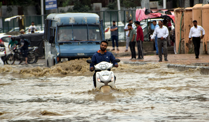 Waterlogged Lal Chowk on Thursday. — Excelsior/Shakeel Waterlogged Lal Chowk on Thursday. — Excelsior/Shakeel