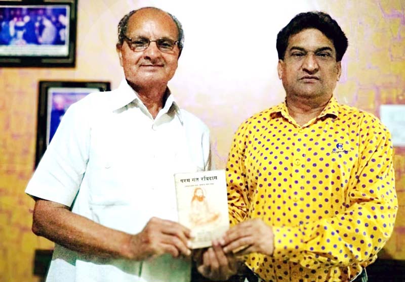 Gian Chand Dogra a well known educationist presenting a book on Guru Ravi Dass to Balbir Ram Rattan national secretary of Guru Ravi Dass Vishwa Mahapeeth at Jammu on Thursday. Gian Chand Dogra a well known educationist presenting a book on Guru Ravi Dass to Balbir Ram Rattan national secretary of Guru Ravi Dass Vishwa Mahapeeth at Jammu on Thursday.