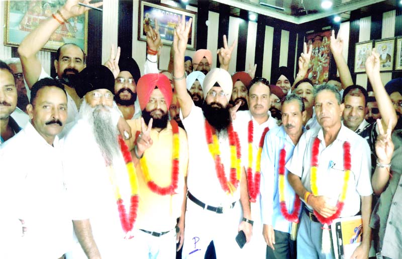 page11-1 New office bearers of ATDA Jammu posing for a group photograph.