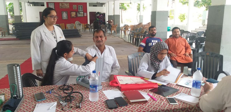 A patient being examined by a doctor during a physiotherapy camp at Channi Himmat in Jammu. A patient being examined by a doctor during a physiotherapy camp at Channi Himmat in Jammu.
