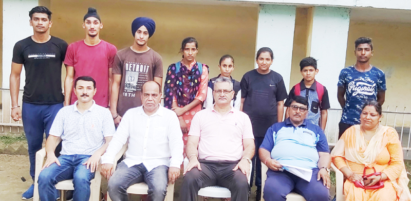 State Athletics team posing along with dignitaries and officials in Jammu on Wednesday. State Athletics team posing along with dignitaries and officials in Jammu on Wednesday.