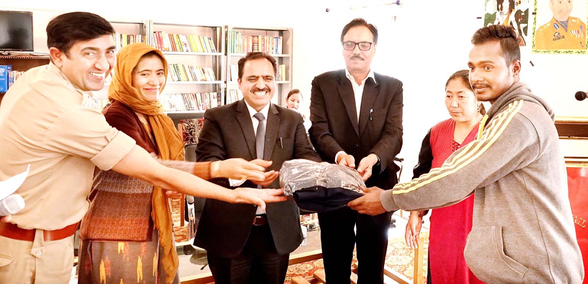 Principal District and Sessions Judge, RS Jasrotia giving track suit to a jail inmate in Leh on Saturday. Principal District and Sessions Judge, RS Jasrotia giving track suit to a jail inmate in Leh on Saturday.