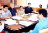 Advisor K K Sharma chairing a meeting at Srinagar on Monday.