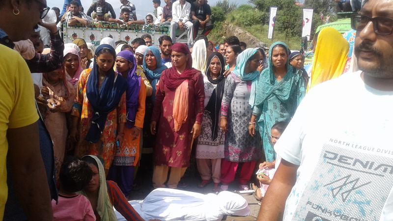 Family members and relatives of deceased PHE worker protesting at Tikri on Wednesday. Family members and relatives of deceased PHE worker protesting at Tikri on Wednesday.