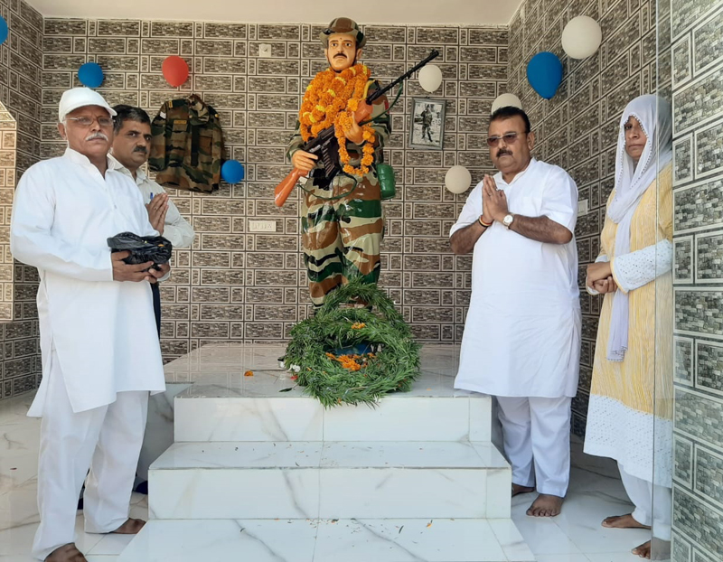 Former Minister C P Ganga paying tributes to martyr Ravi Paul at his native village Sarwa in Ramgarh tehsil on Wednesday. Former Minister C P Ganga paying tributes to martyr Ravi Paul at his native village Sarwa in Ramgarh tehsil on Wednesday.