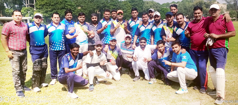 Teams posing for a group photograph after playing a friendly cricket match in Jammu. Teams posing for a group photograph after playing a friendly cricket match in Jammu.