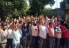 PDD employees protesting in Jammu on Sunday.