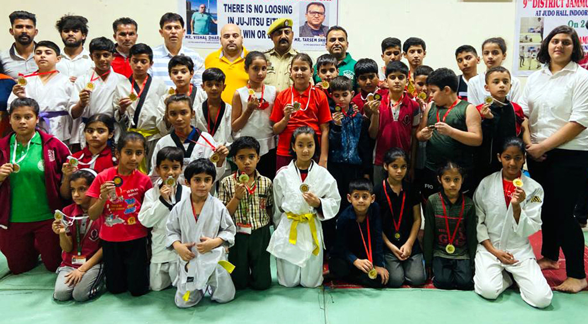 Medal winners of Ju-Jitsu Championship posing along with dignitaries and officials in Jammu. Medal winners of Ju-Jitsu Championship posing along with dignitaries and officials in Jammu.