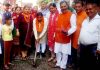 Former minister, Sat Sharma kick starting construction of lane in ward 37 on Saturday.