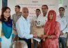 Director Research of SKUAST-J distributing quality seeds among farmers during awarness programme in Kathua on Wednesday.