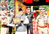 Governor Satya Pal Malik awarding a recruit during 26th BRTC passing out parade at S. Prithinandan Singh Police Training School Kathua on Monday.