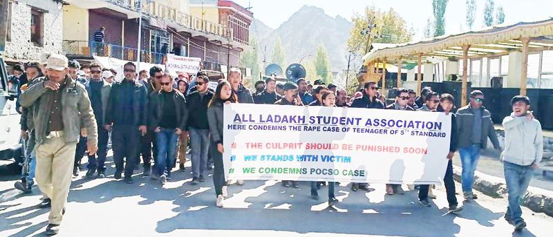 Student activists and others taking out a protest rally at Leh on Monday. -Excelsior/ Morup Stanzin Student activists and others taking out a protest rally at Leh on Monday. -Excelsior/ Morup Stanzin