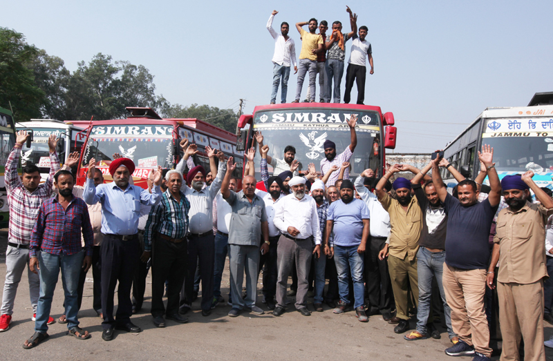 Transporters protesting at Ware House in Jammu on Monday. —Excelsior/Rakesh Transporters protesting at Ware House in Jammu on Monday. —Excelsior/Rakesh