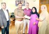 DGP Dilbag Singh presenting cheque to mother of a martyr at Srinagar on Tuesday.