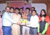 Chief guest Raman Suri and artists from Vomedh receiving a bouquet from Regional Director, ICCR, NK Shil during a function in Jammu.