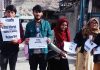 Students carrying placards during protest at Kargil. —Excelsior/Basharat Ladakhi
