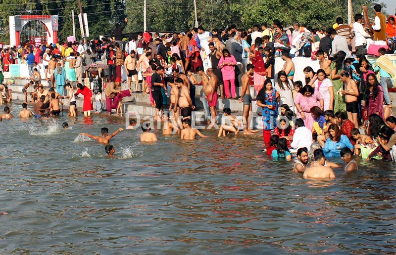 Devotees taking a dip in holy pond as nine-day long Jhiri mela begins on Tuesday. —Excelsior/Rakesh