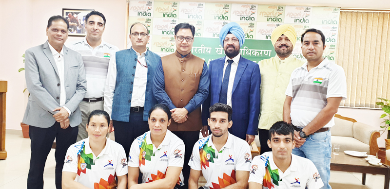 Wushu medallists and coaches posing along with Union Sports Minister, Kiran Rijiju and other dignitaries during felicitation function in Delhi. Wushu medallists and coaches posing along with Union Sports Minister, Kiran Rijiju and other dignitaries during felicitation function in Delhi.