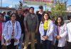 A team of doctors and volunteers posing during a medical camp in Jammu.