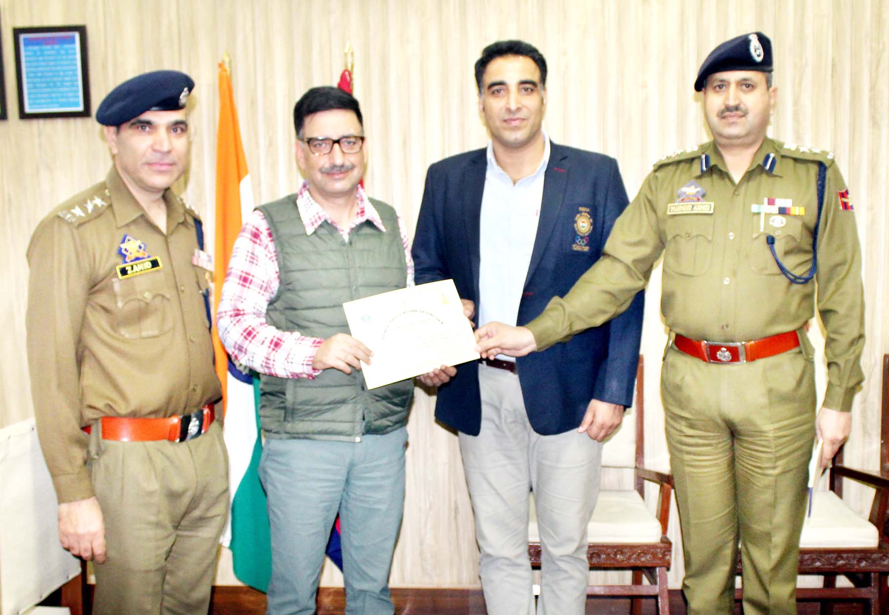 Chief Wushu Coach of India Kuldeep Handoo being honoured by ADGP Armed SJM Gillani in Jammu on Saturday. Chief Wushu Coach of India Kuldeep Handoo being honoured by ADGP Armed SJM Gillani in Jammu on Saturday.