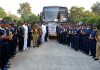 Old Age persons and BSF officials posing for group photograph after conclusion of Bharat Darshan tour.
