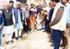 Congress leader, Vikram Malhotra kick starting construction of lanes and drains in Jammu East on Monday.