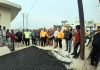 Former Deputy CM, Kavinder Gupta kick-starting black topping of lanes in Channi on Wednesday.