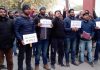 Non-local employees during a protest demonstration at Kargil on Monday. —Excelsior/Basharat