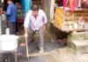 Shopkeepers cleaning a chocked drain in Samba market on Wednesday.