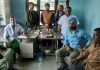 Doctors and patients during a medical camp at Pounichak in Jammu.