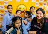Children posing with RJ of 98.3 Mirchi at Mirchi studio in Jammu.
