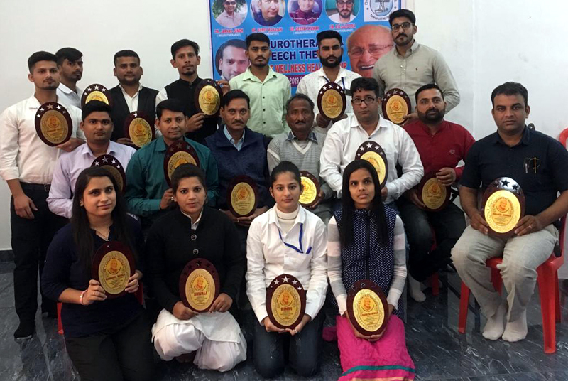 Participants, who offered their services during free Neurotherapy and Speech Therapy Camp, posing for group photograph after being awarded with trophies. Participants, who offered their services during free Neurotherapy and Speech Therapy Camp, posing for group photograph after being awarded with trophies.