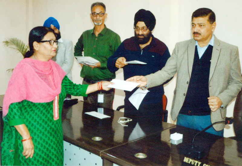 DC, Samba Rohit Khajuria handing over financial assistance sanction letter to a beneficiary at Samba on Wednesday. DC, Samba Rohit Khajuria handing over financial assistance sanction letter to a beneficiary at Samba on Wednesday.