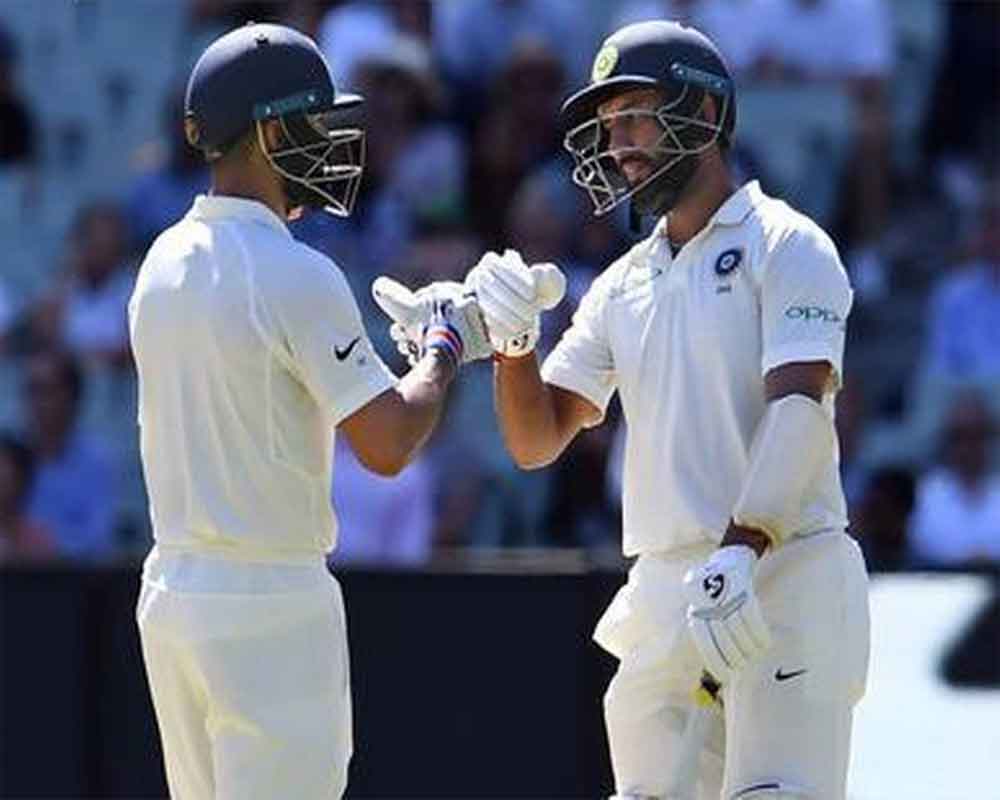Kohli with Pujara