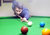 Cueist Adnan Lone aiming target at Billiards Hall, MA Stadium in Jammu.