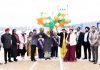 Dignitaries releasing ballons while declaring open sports meet.