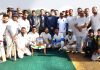 Players of participating team and dignitaries posing for group photograph.