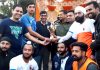 Poonch Rahul Yadav presenting title trophy to the winner team.