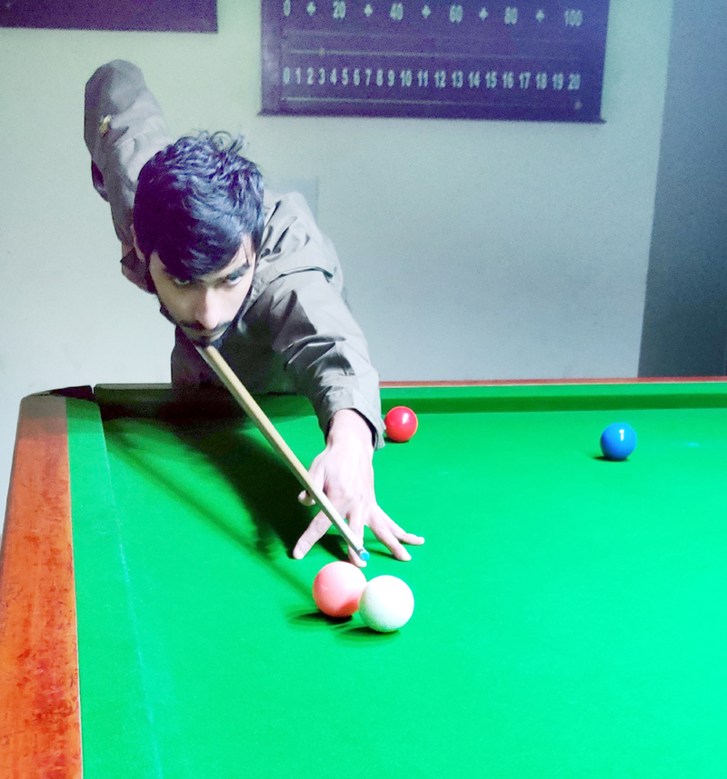 A Cueist aiming at target during a match of Jr Snooker tournament in Jammu on Thursday. -Excelsior/Rakesh A Cueist aiming at target during a match of Jr Snooker tournament in Jammu on Thursday. -Excelsior/Rakesh