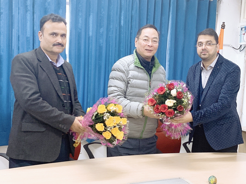 Staff members of office of Director Finance (P) J&K Circle Jammu presenting bouquet to retiring PD Tshering, CPMG J&K Circle Jammu. Staff members of office of Director Finance (P) J&K Circle Jammu presenting bouquet to retiring PD Tshering, CPMG J&K Circle Jammu.