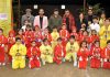 Students in colourful attires posing along with dignitaries and officials during Annual Sports Day celebration in Jammu.