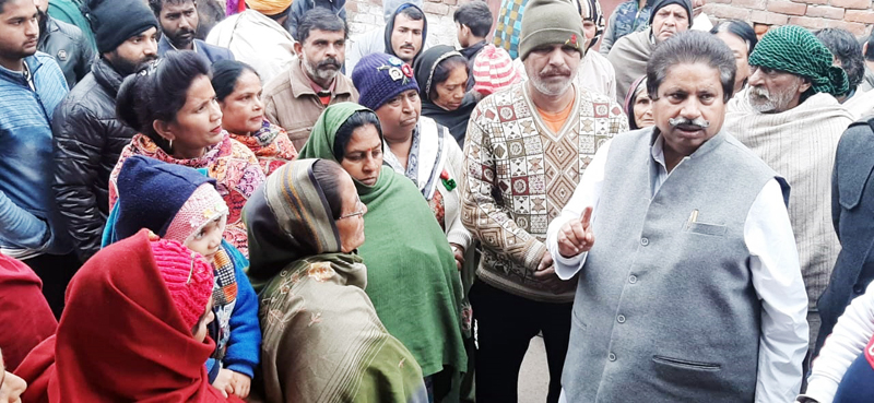 PCC leader Raman Bhalla interacting with people in Gandhi Nagar in Jammu on Monday. PCC leader Raman Bhalla interacting with people in Gandhi Nagar in Jammu on Monday.