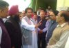Cong leader Raman Bhalla interacting with people in Gandhi Nagar on Monday.