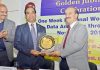 A resource person being felicitated at a workshop in Jammu University on Saturday.