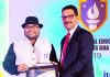 Principal, MVIS Kundan Lal Dogra receiving award from Ajay Kumar, Advisor, HRD Ministry.