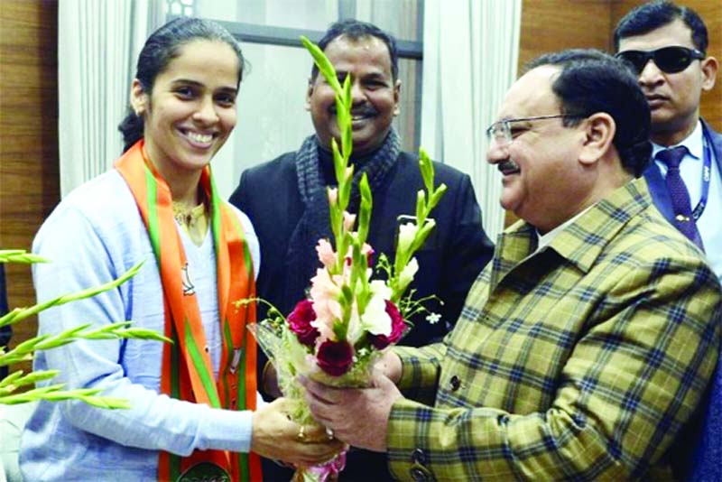 Badminton player Saina Nehwal meet BJP President J P Nadda (R) after they joined Bharatiya Janata Party, in New Delhi on Wednesday. Badminton player Saina Nehwal meet BJP President J P Nadda (R) after they joined Bharatiya Janata Party, in New Delhi on Wednesday.
